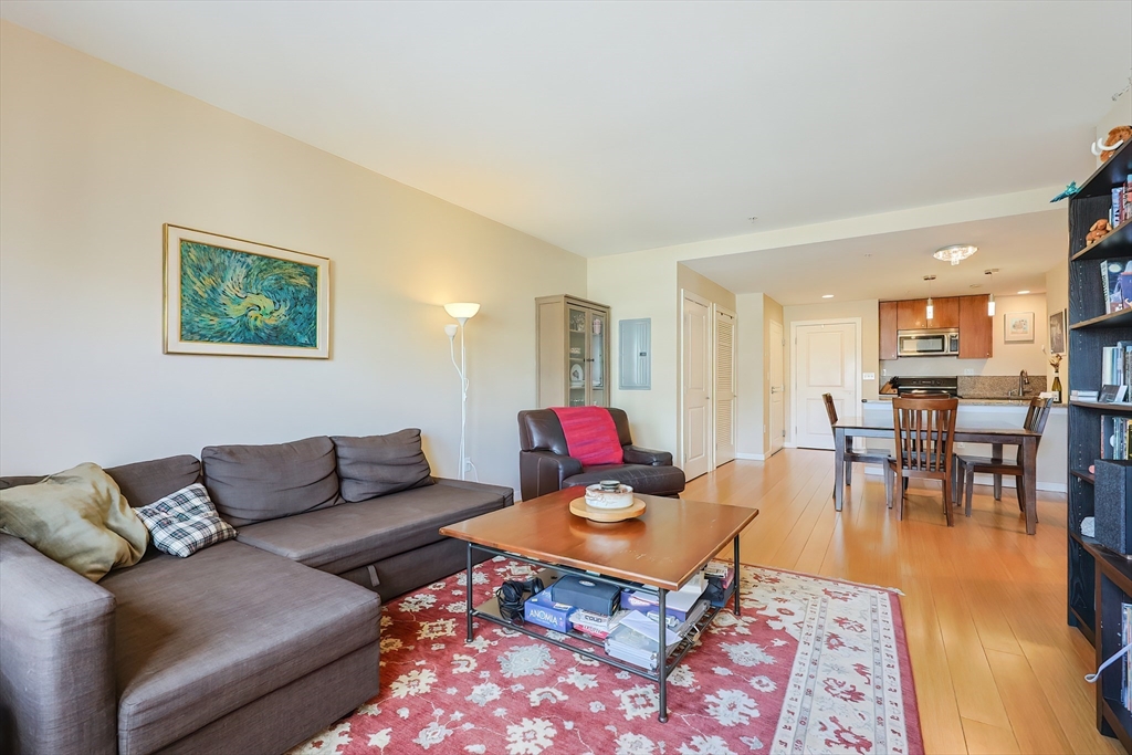 16 Miner Street, Unit 501 Boston, MA 02215 - Photo 11 of 40 a living room with furniture and wooden floor