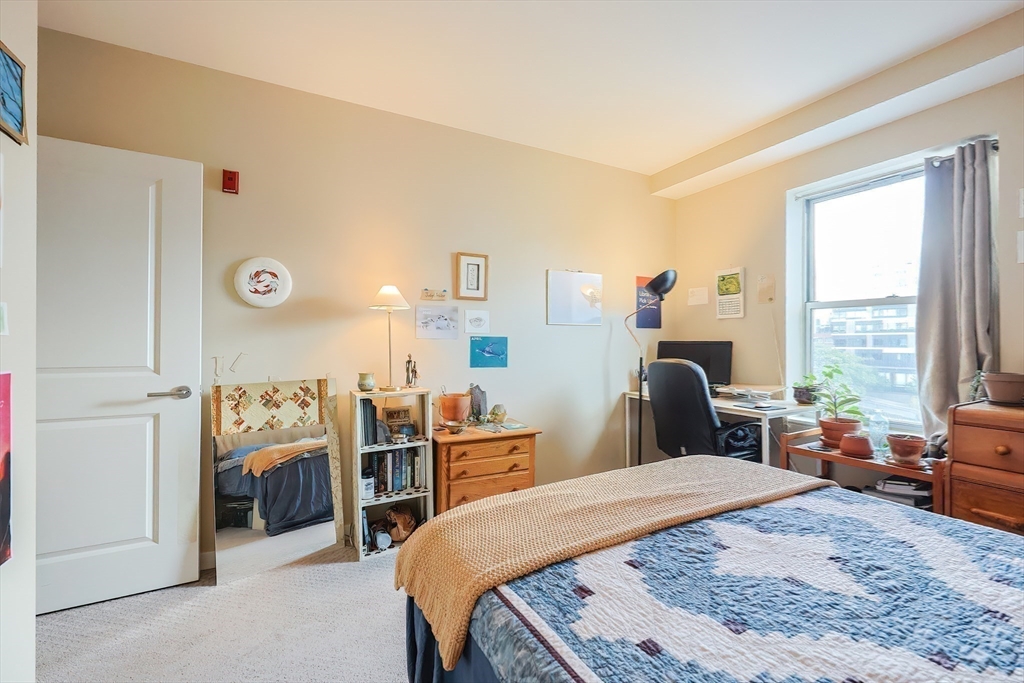 16 Miner Street, Unit 501 Boston, MA 02215 - Photo 19 of 40 a bed room with a bed and a window