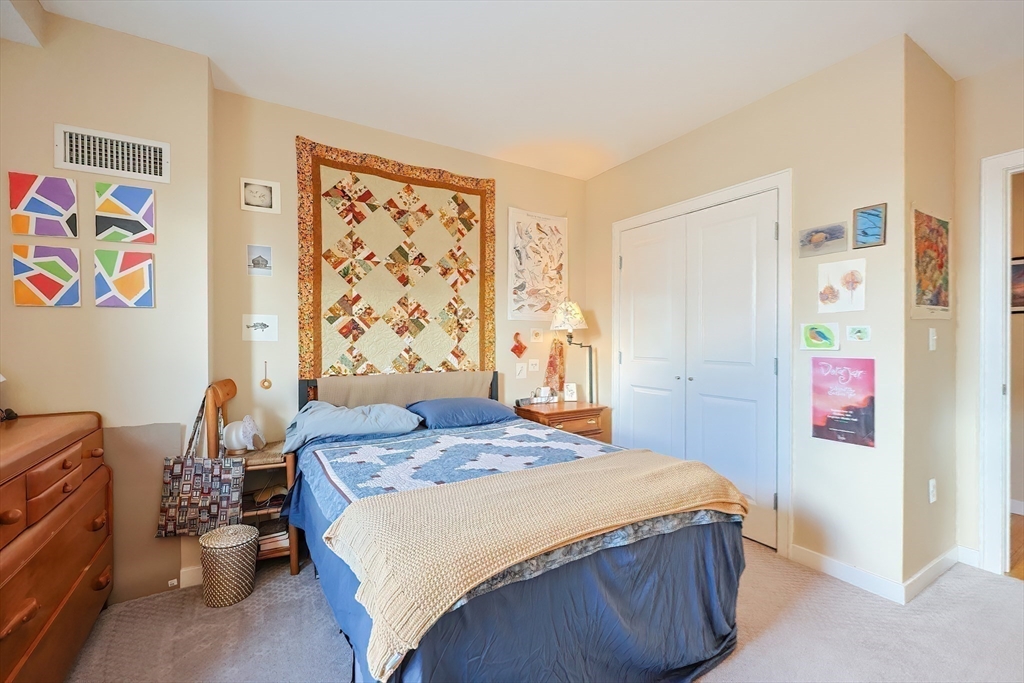 16 Miner Street, Unit 501 Boston, MA 02215 - Photo 20 of 40 a bedroom with a bed and a window