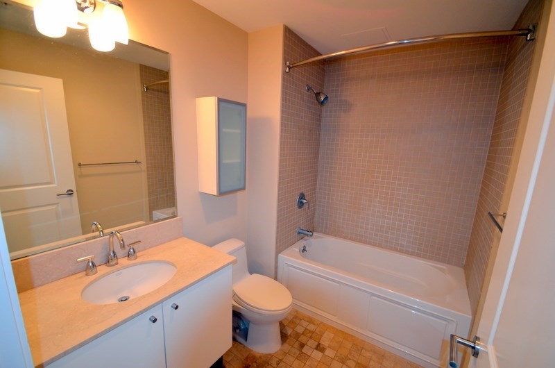 16 Miner Street, Unit 501 Boston, MA 02215 - Photo 38 of 40 a bathroom with a granite countertop sink toilet and shower