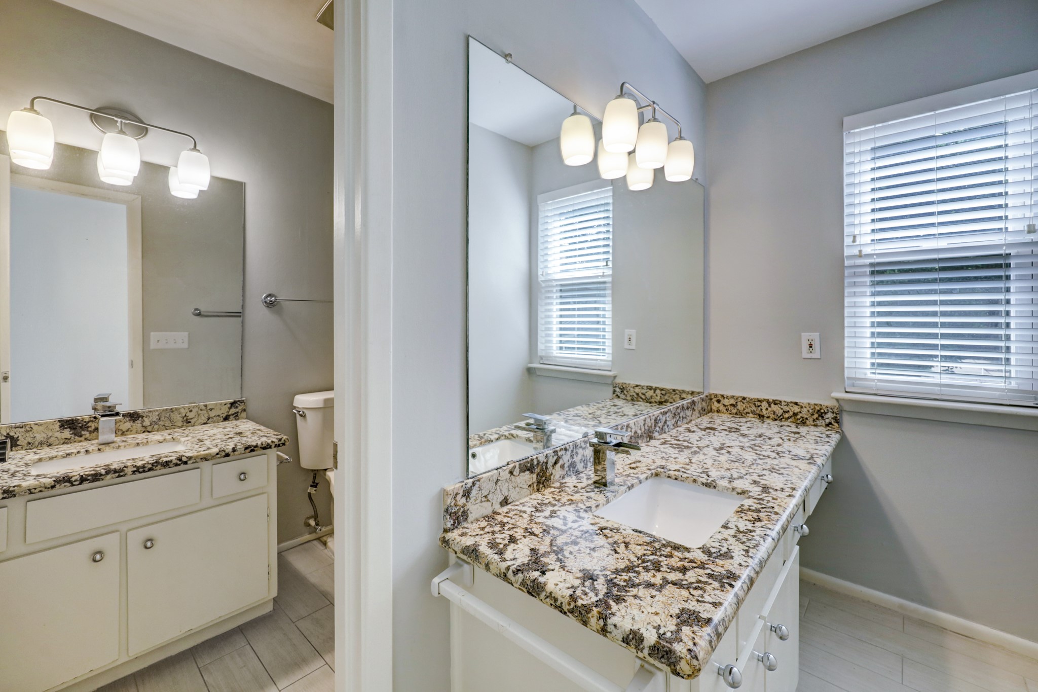 1611 Prairie Mark Lane, Unit 80 Houston, TX 77077 - Photo 6 of 10 a bathroom with a granite countertop sink and a mirror