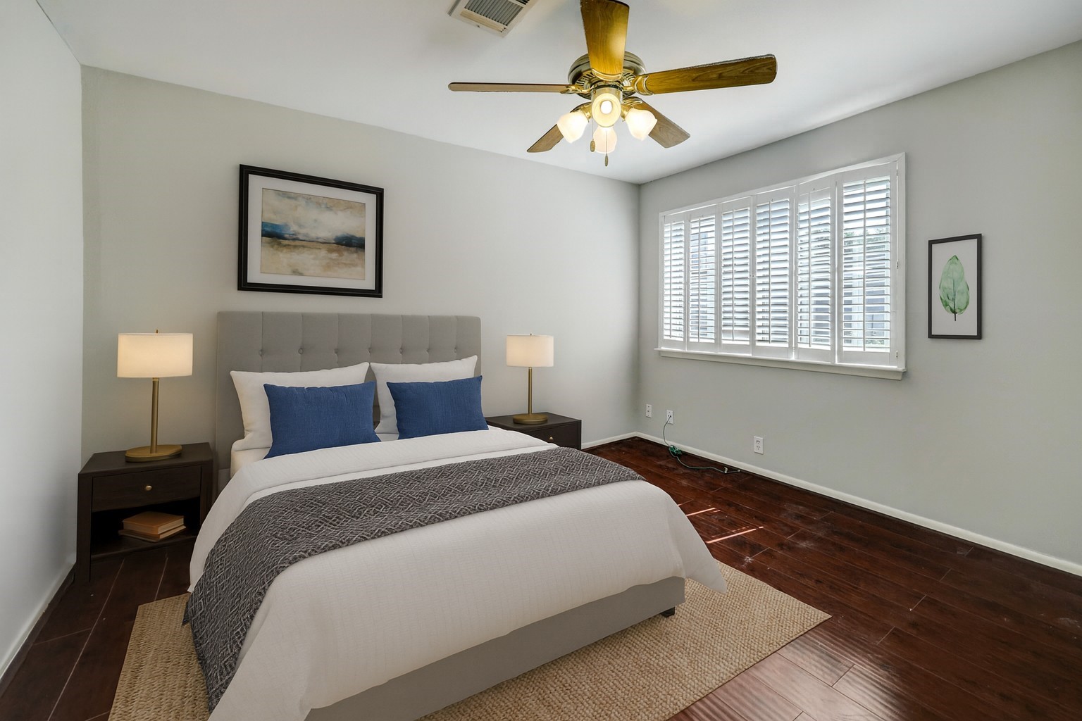 1611 Prairie Mark Lane, Unit 80 Houston, TX 77077 - Photo 9 of 10 a bedroom with a bed and a chandelier