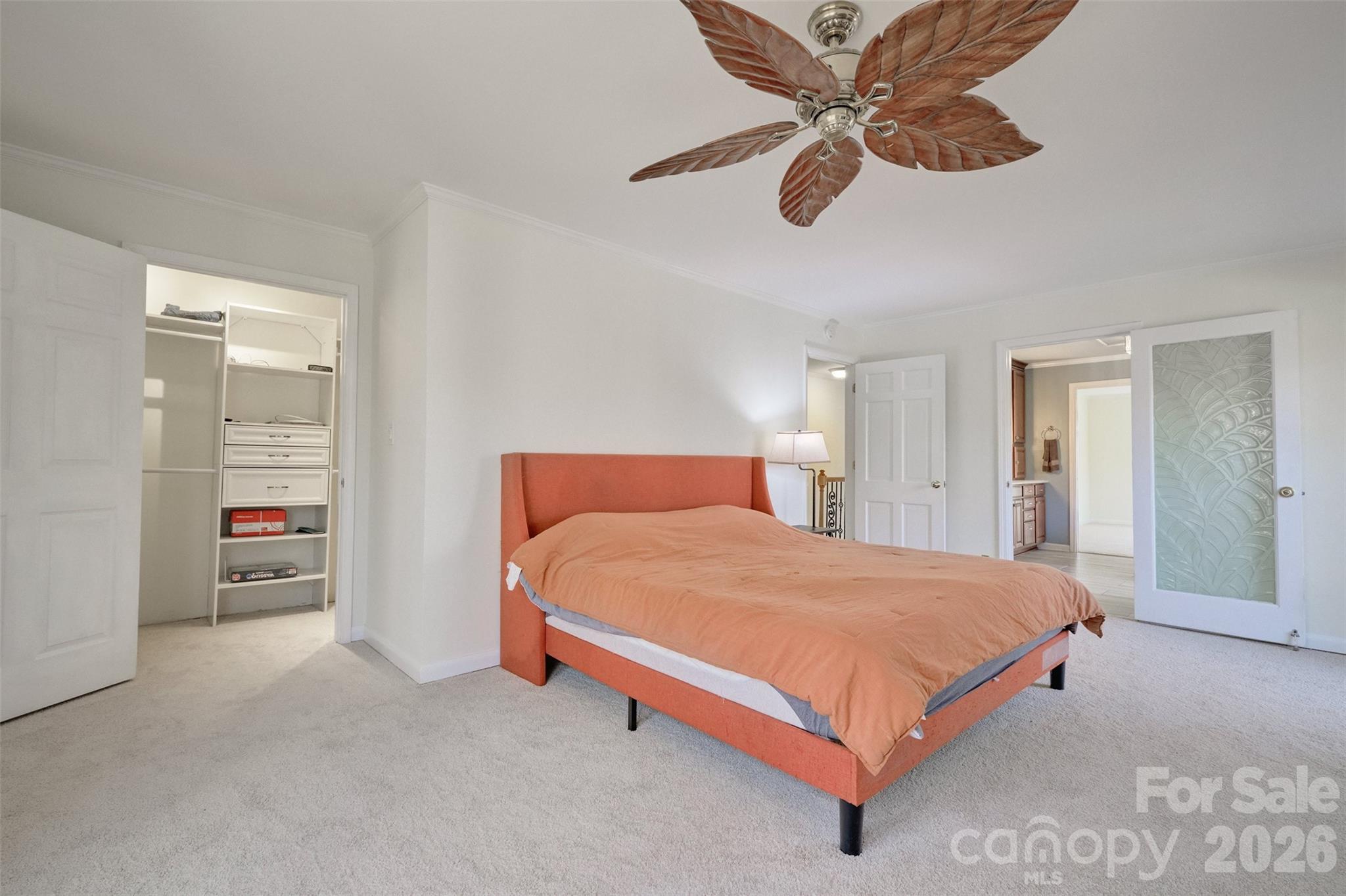 26 Fairway Ridge Lake Wylie, SC 29710 - Photo 20 of 48 a bedroom with a bed and a chandelier