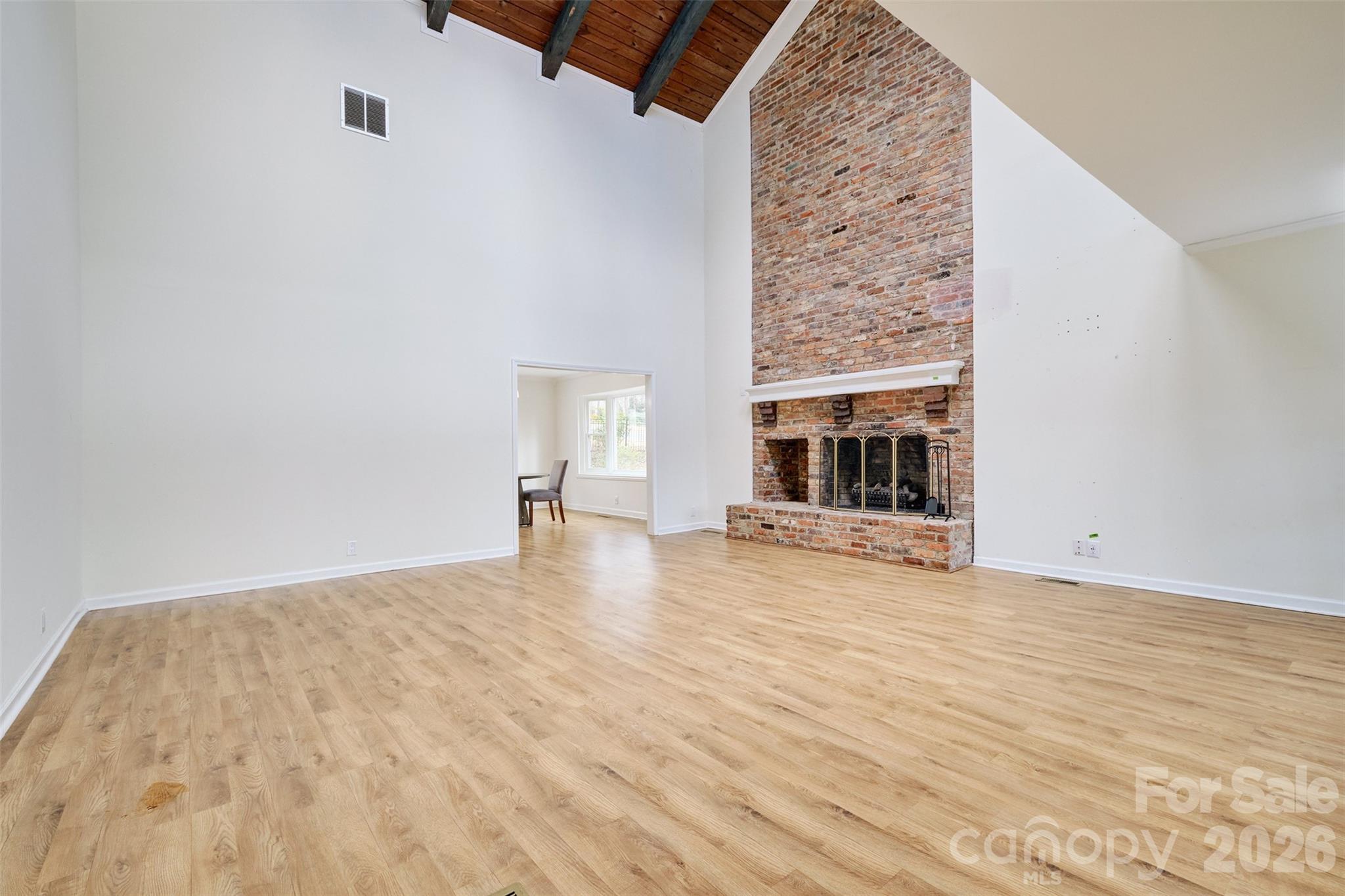 26 Fairway Ridge Lake Wylie, SC 29710 - Photo 6 of 48 a view of empty room with fireplace and wooden floor