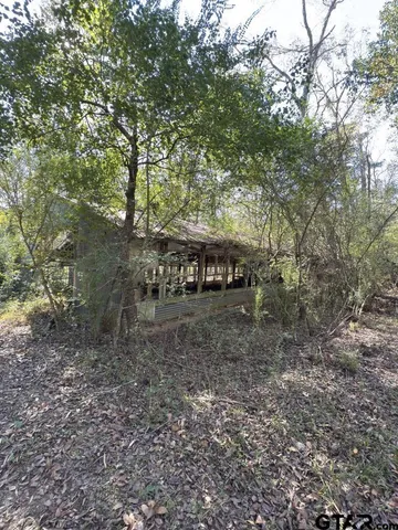 a view of house with yard and entertaining space
