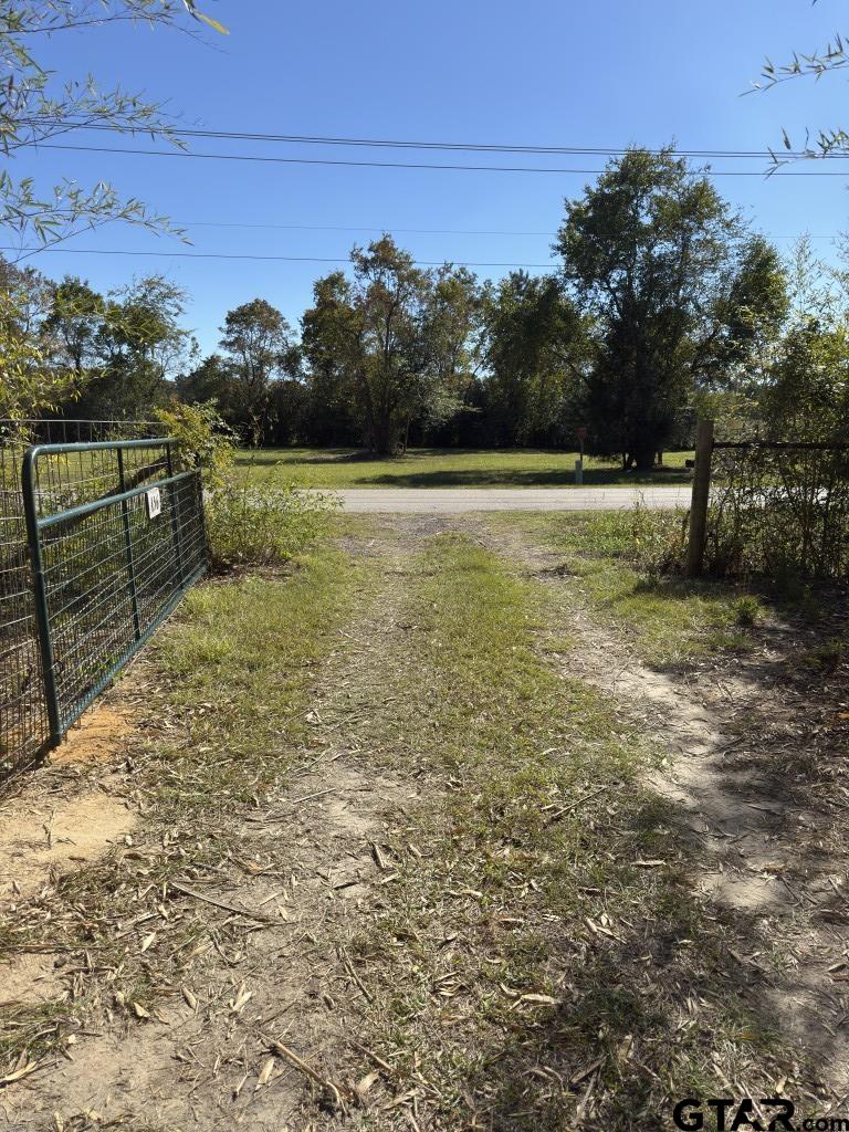456 Marshall Ivy Road Huntington, TX 75949 - Photo 25 of 32 a view of a yard with wooden fence
