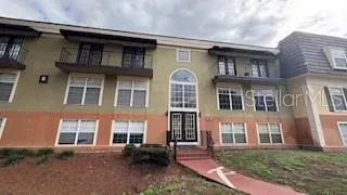 a front view of residential houses with outdoor space