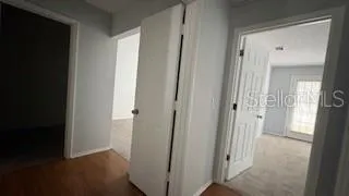 a view of a bathroom from the hallway