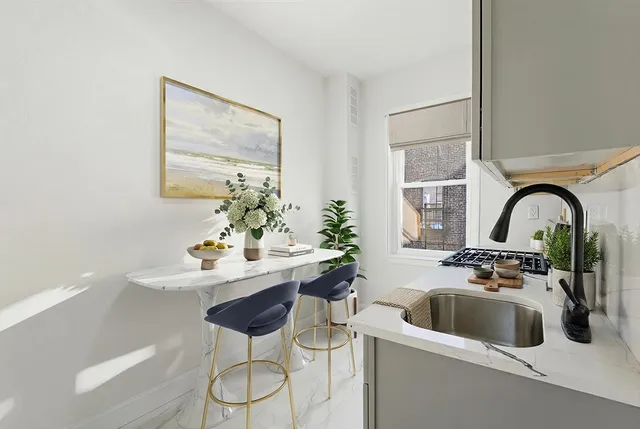 a kitchen with a sink and a refrigerator