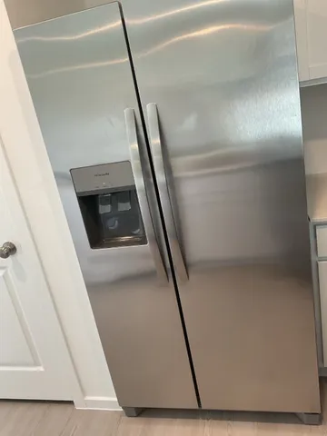 a view of house with a swimming pool and outdoor seating