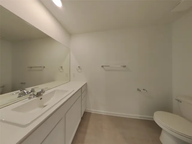 a bathroom with a shower a toilet and a shower