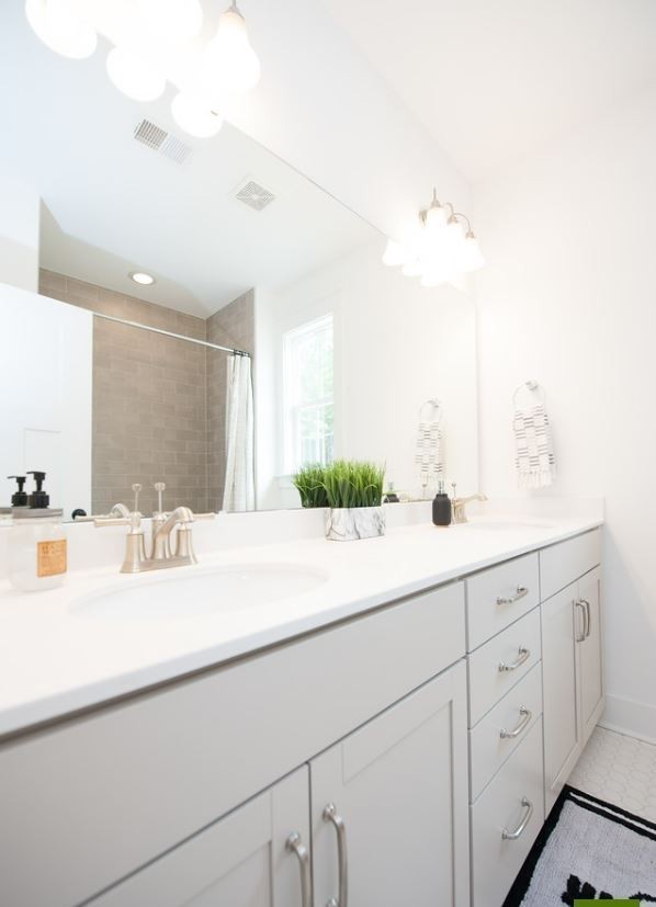 711 Conifer Drive Spring Hill, TN 37174 - Photo 14 of 19 a bathroom with a sink and a mirror