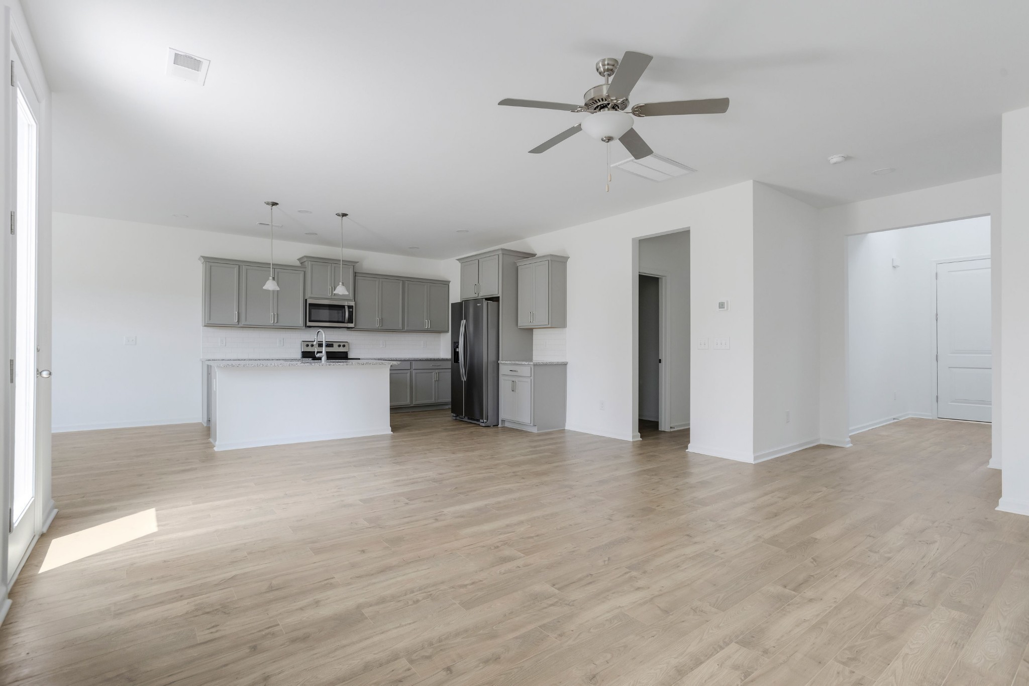 711 Conifer Drive Spring Hill, TN 37174 - Photo 18 of 19 a view of a kitchen with a sink and a refrigerator
