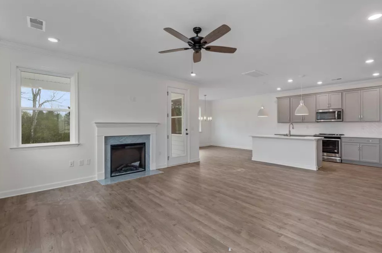 711 Conifer Drive Spring Hill, TN 37174 - Photo 5 of 19 a view of an empty room with kitchen and a window