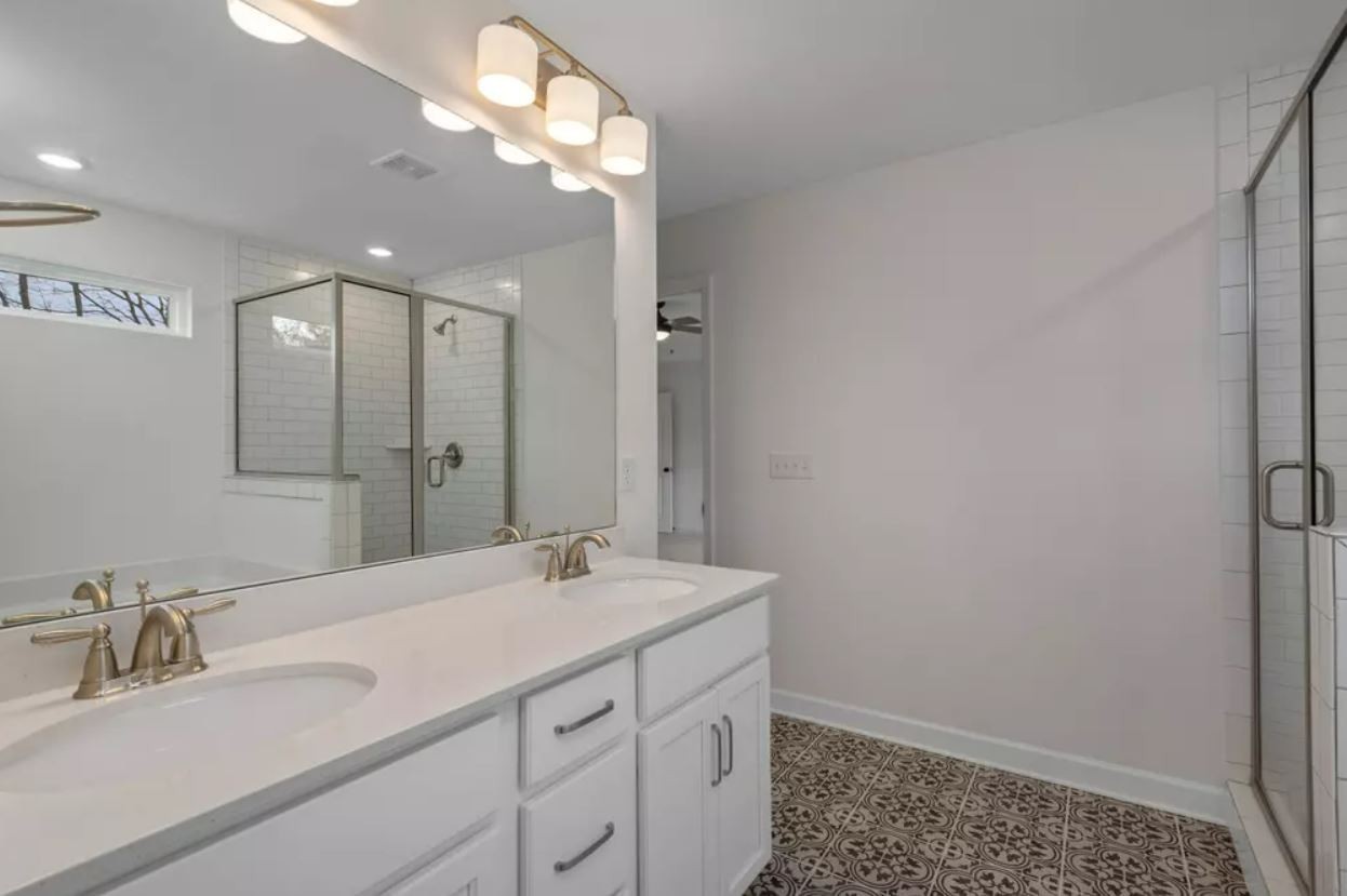 711 Conifer Drive Spring Hill, TN 37174 - Photo 10 of 19 a bathroom with a sink and a mirror