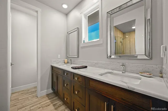 a bathroom with a sink and a mirror