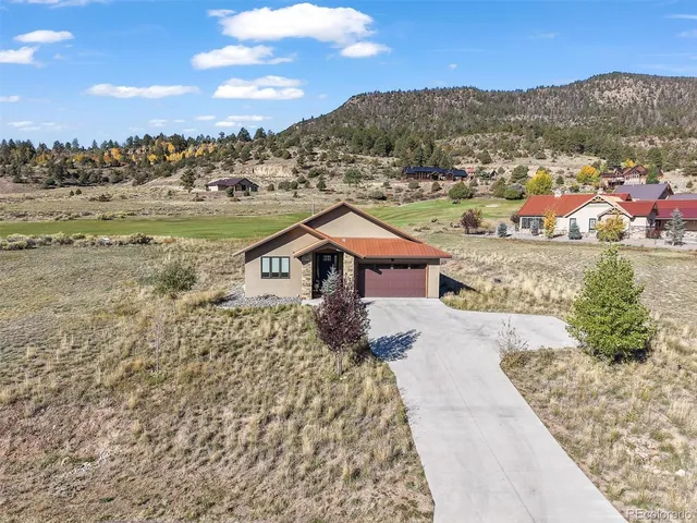 a view of a town with mountains in the background