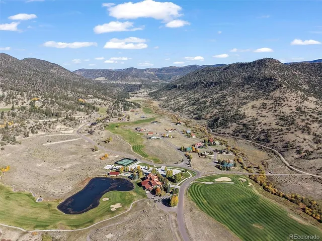 an aerial view of a houses with outdoor space
