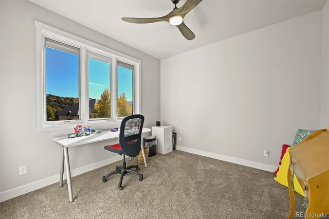 a view of a kitchen area with furniture and wooden floor