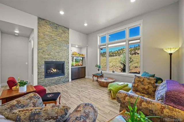 a living room with furniture and a fireplace
