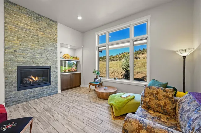 a room with a fireplace and a fireplace