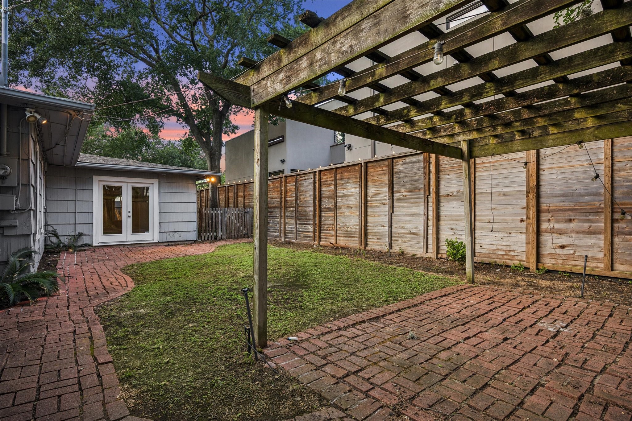 1931 Bissonnet Street Houston, TX 77005 - Photo 22 of 22 a view of a house with backyard and a backyard
