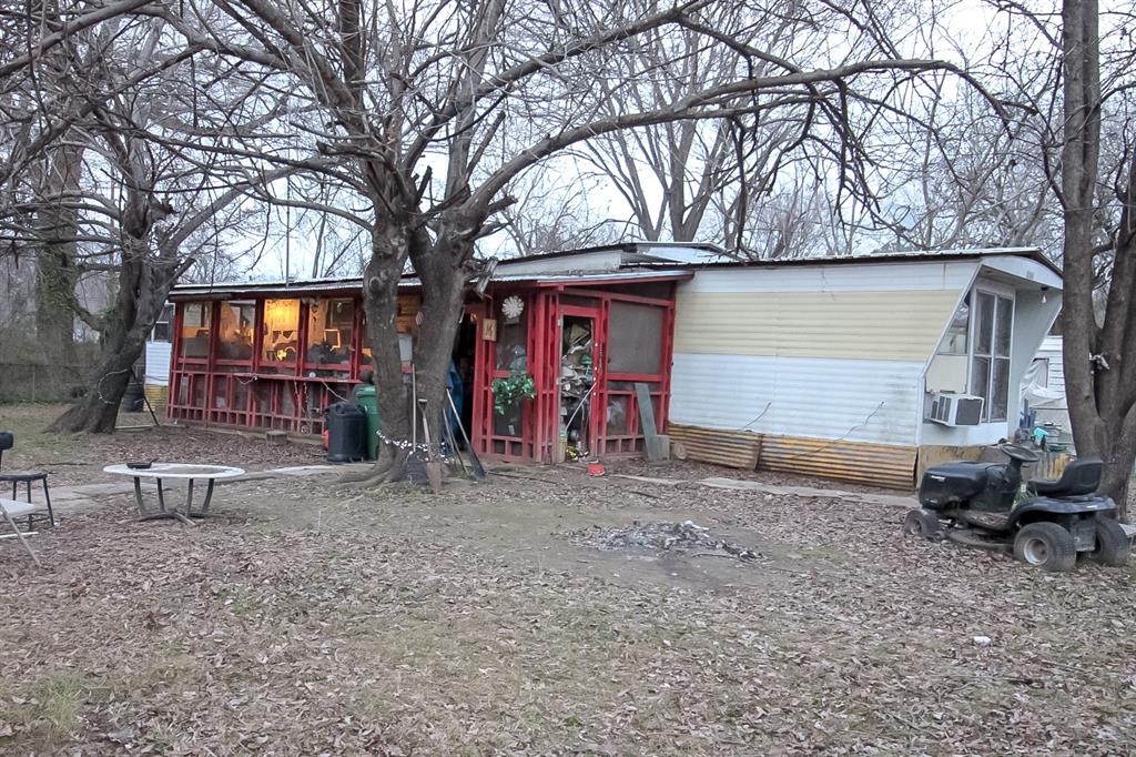 210 East 9th Hooks, TX 75561 - Photo 1 of 1 a view of house with backyard space and furniture