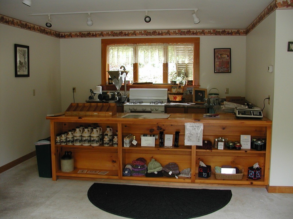 47 Goshen Road Williamsburg, MA 01096 - Photo 5 of 24 a room with lots of wooden furniture and a window