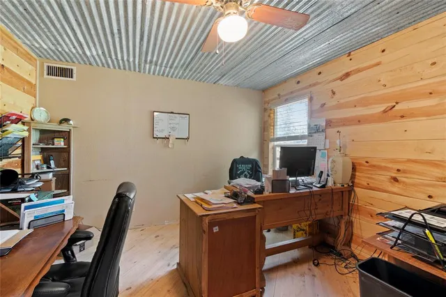 a view of a workspace with furniture