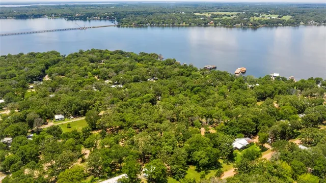 a view of a lake with houses in the back