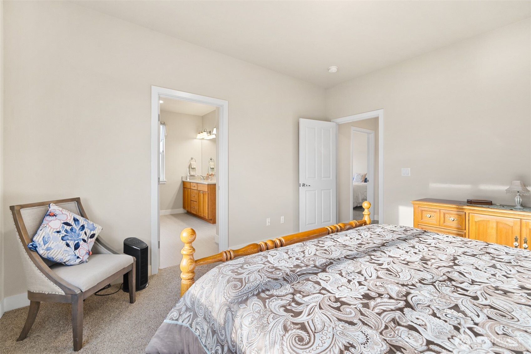 440 Blue Glacier Loop Sequim, WA 98382 - Photo 15 of 34 a bedroom with a bed and a lamp with the view of a bedroom