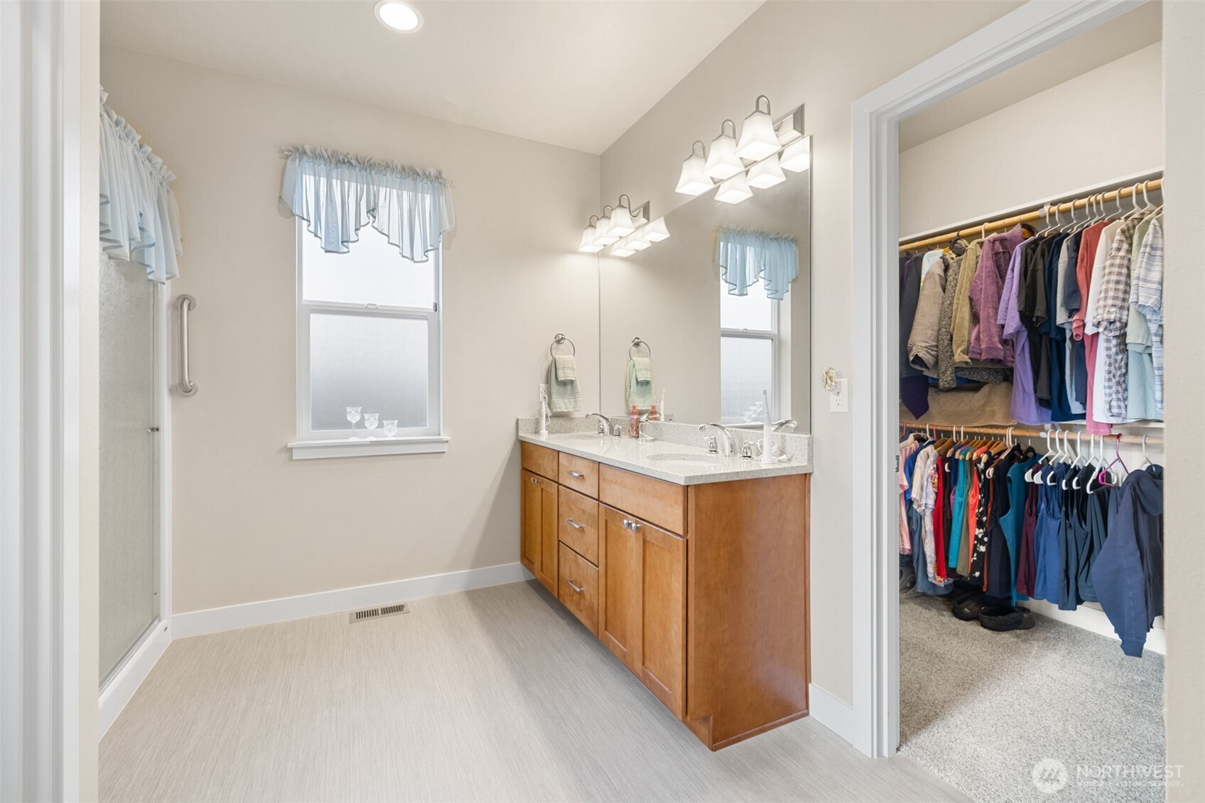 440 Blue Glacier Loop Sequim, WA 98382 - Photo 16 of 34 a view of a bathroom with dual sinks