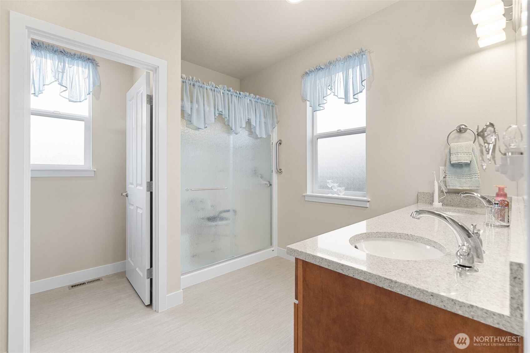 440 Blue Glacier Loop Sequim, WA 98382 - Photo 17 of 34 a bathroom with a sink a vanity and a mirror