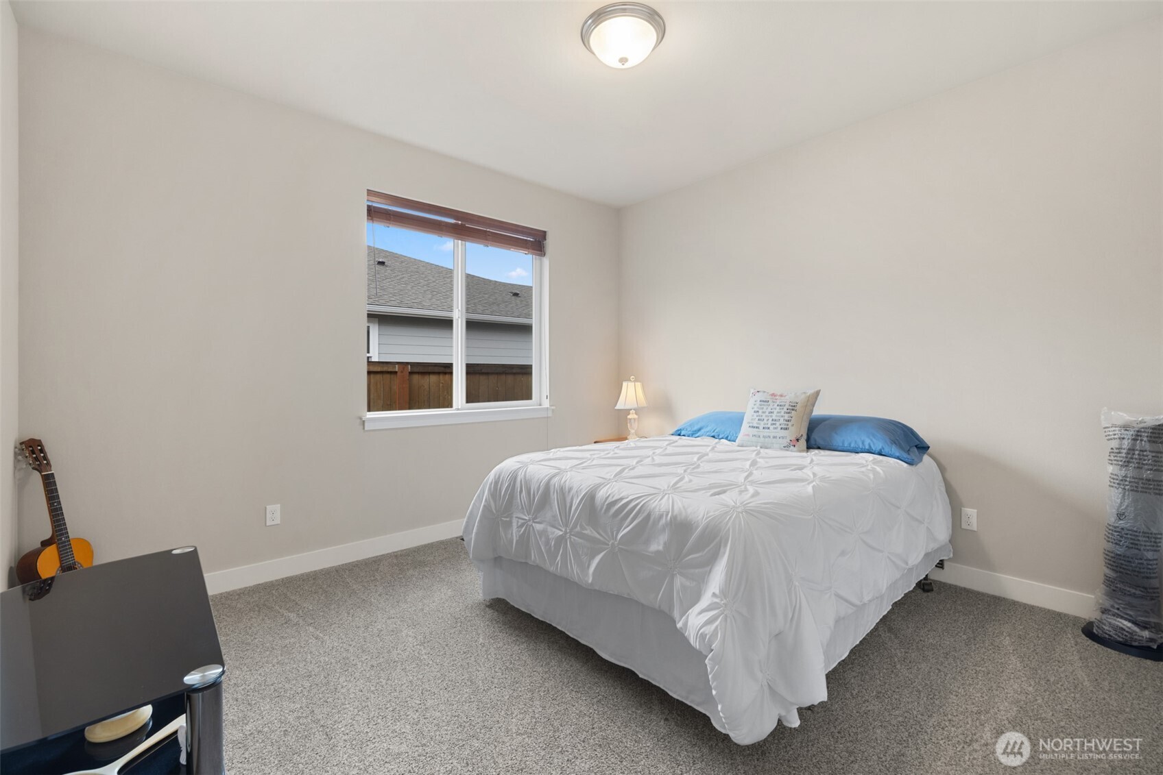 440 Blue Glacier Loop Sequim, WA 98382 - Photo 18 of 34 a bedroom with a bed and window