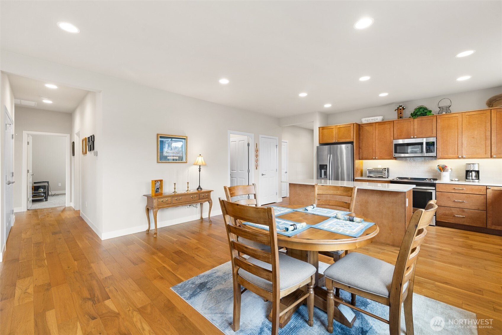 440 Blue Glacier Loop Sequim, WA 98382 - Photo 9 of 34 a living room with stainless steel appliances kitchen island granite countertop furniture and a dining table