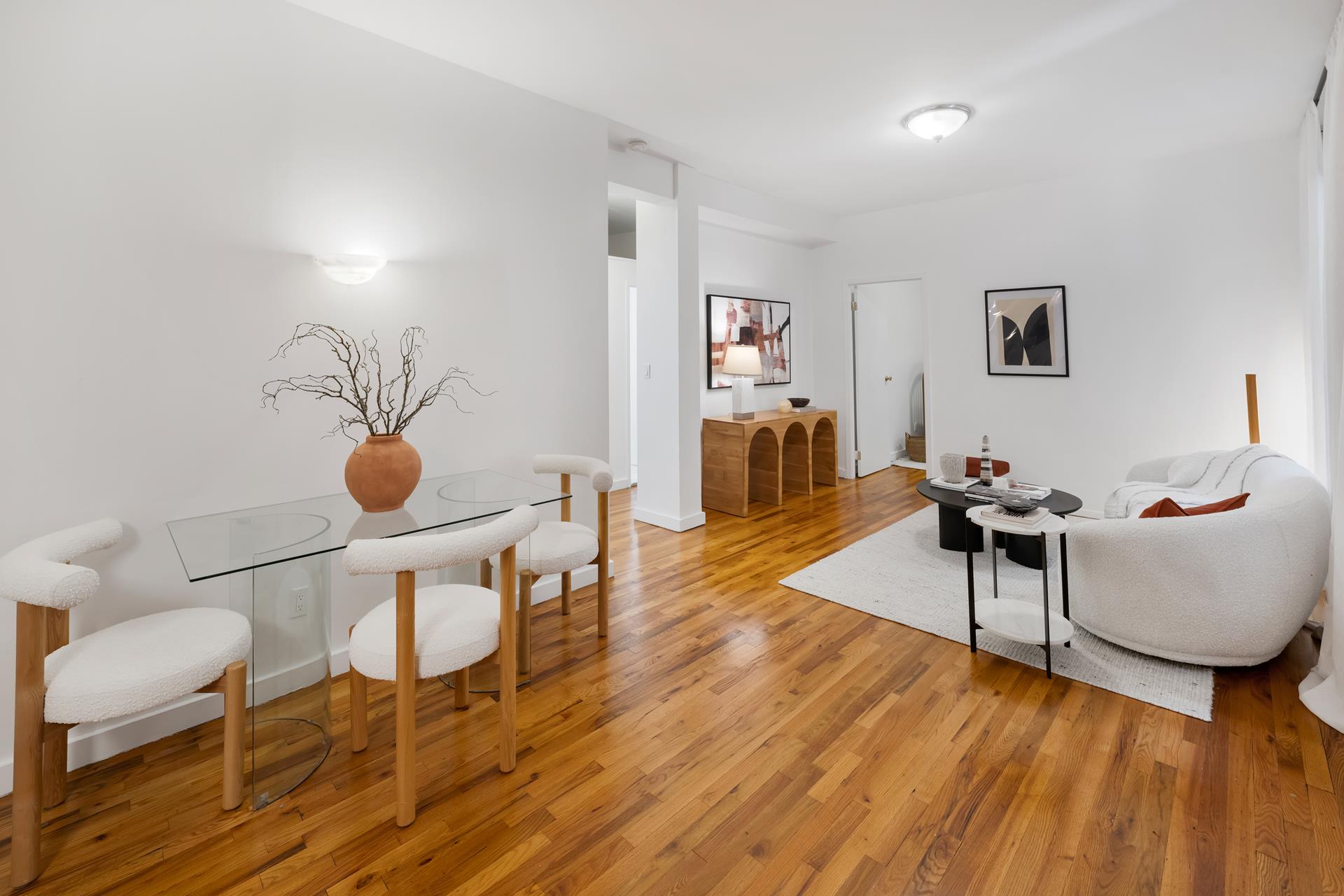 314 West 94th Street, Unit 2A Manhattan, NY 10025 - Photo 2 of 10 a living room with furniture and wooden floor