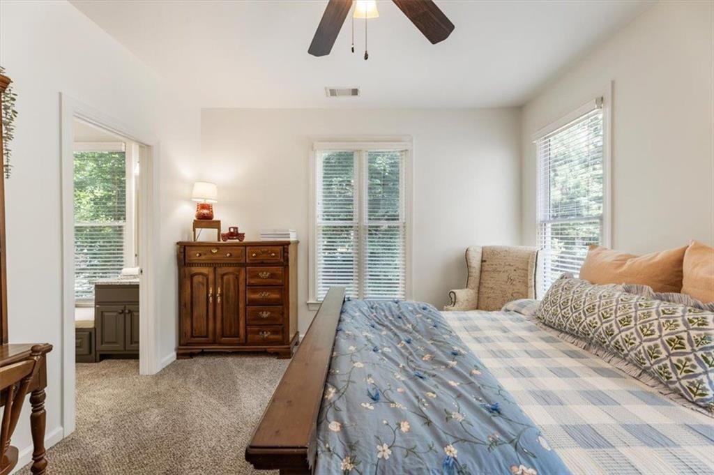 3910 Two Rivers Drive Cumming, GA 30041 - Photo 58 of 110 a bedroom with a bed and a window