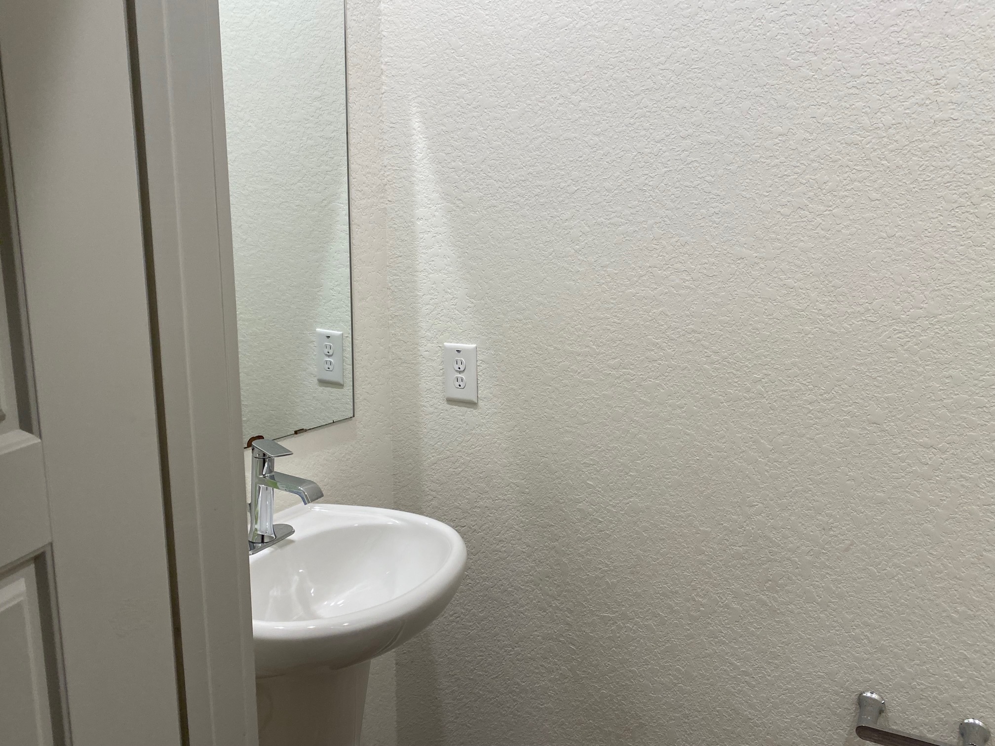 121 Parryi Cove Leander, TX 78641 - Photo 23 of 37 a bathroom with a sink and mirror