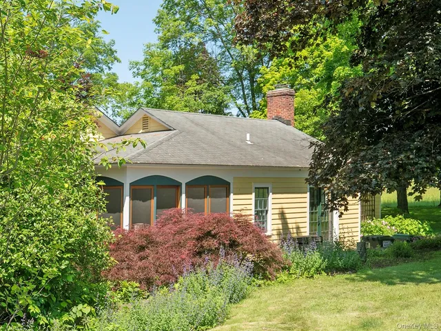 a kitchen with sink window and cabinets