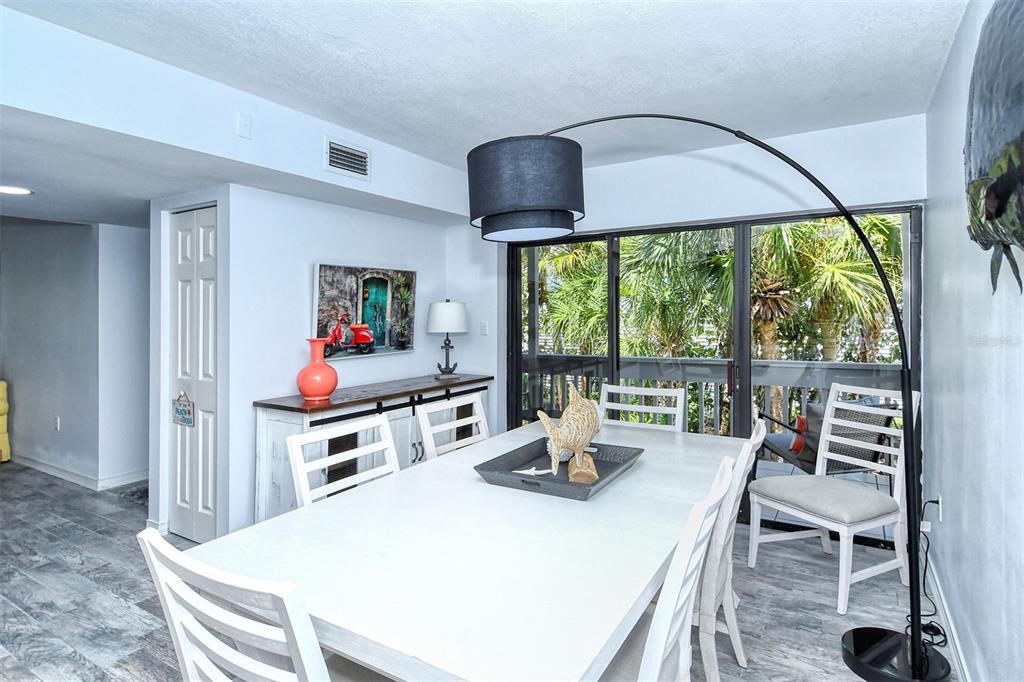 450 Beach Road, Unit 5 Sarasota, FL 34242 - Photo 16 of 59 Dining room and porch overlooking the front walk way to the beach.