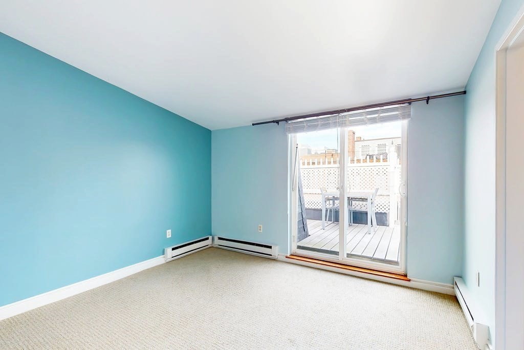 16 Symphony Road, Unit 5 Boston, MA 02115 - Photo 19 of 36 an empty room with an outdoor view and window