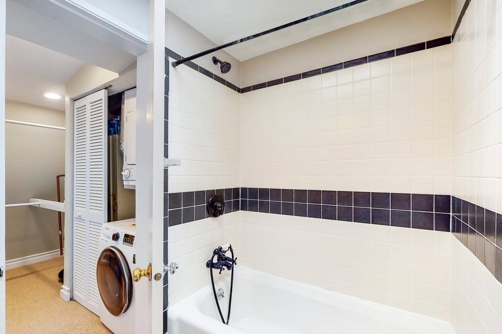 16 Symphony Road, Unit 5 Boston, MA 02115 - Photo 29 of 36 a bathroom with a bathtub and a shower
