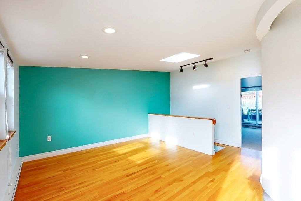 16 Symphony Road, Unit 5 Boston, MA 02115 - Photo 4 of 36 a view of a room with a ceiling fan and window