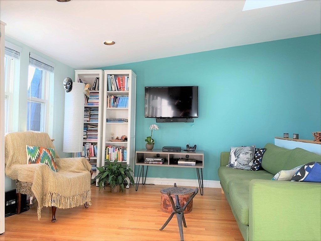 16 Symphony Road, Unit 5 Boston, MA 02115 - Photo 7 of 36 a living room with furniture and a flat screen tv