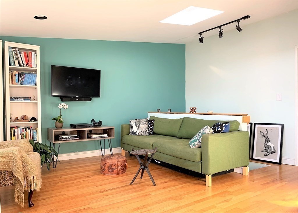 16 Symphony Road, Unit 5 Boston, MA 02115 - Photo 8 of 36 a living room with furniture and a flat screen tv