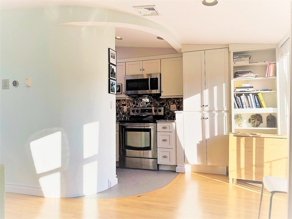 16 Symphony Road, Unit 5 Boston, MA 02115 - Photo 9 of 36 a kitchen with granite countertop a refrigerator stove and sink