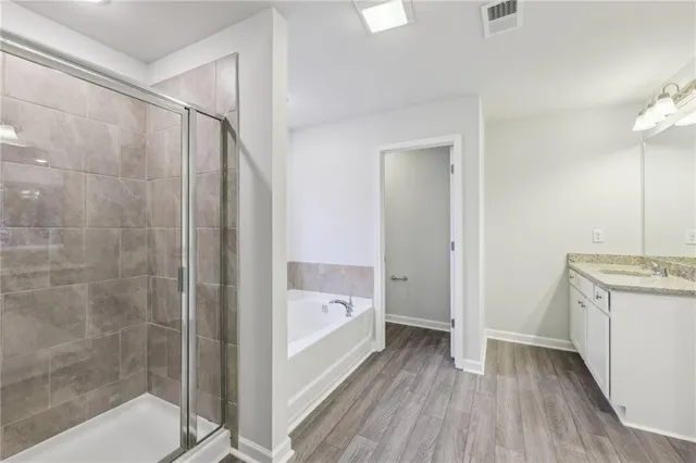 a bathroom with a bathtub and a shower