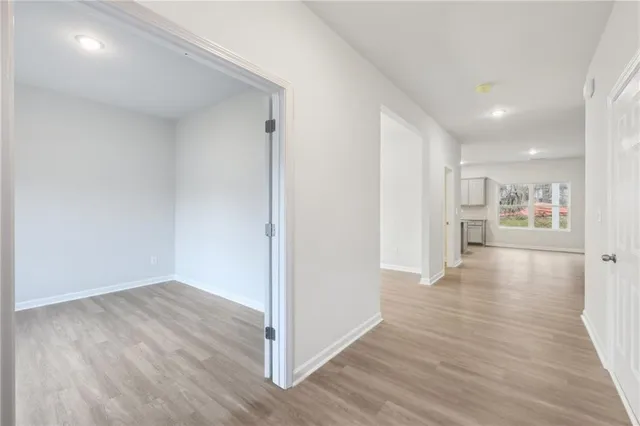 a view of a kitchen with wooden floor