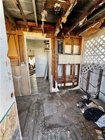 a view of an empty room with windows