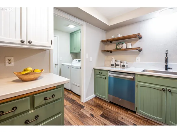a kitchen with a sink and cabinets
